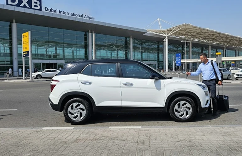 a man who is picking up car rental at the airport