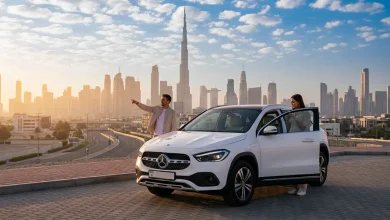 a man standing near rental car in Dubai